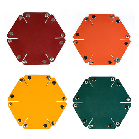 Foto conjunto cuatro bandejas tiradados hexagonales pequeñas. De izq a dcha y de arriba a abajo: granate, naranja, amarilla y verde oscuro.