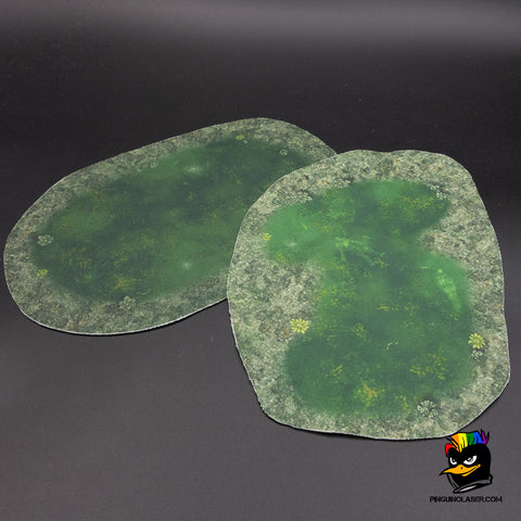 La foto muestra dos "charcas contaminadas" en tela mágica con tonos verdosos por el contaminante.