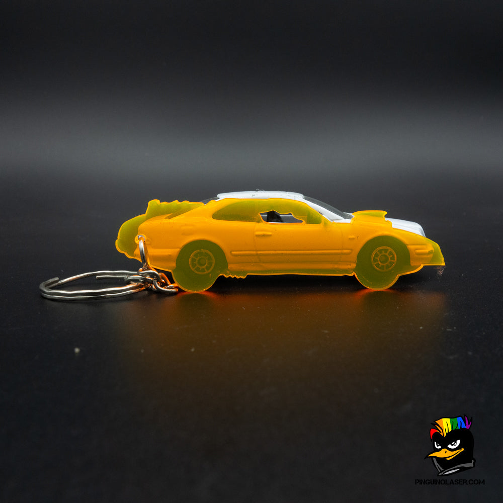 Foto llavero de escala para coche con un coche de ejemplo detrás para que se vea la exactitud